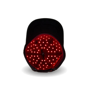 The Halo red light therapy cap showing the inside section with glowing LEDs on.