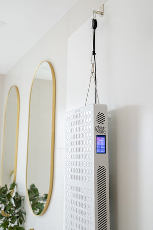 The Radiance300 red light panel shown from the side view on the height adjustable door hanging kit